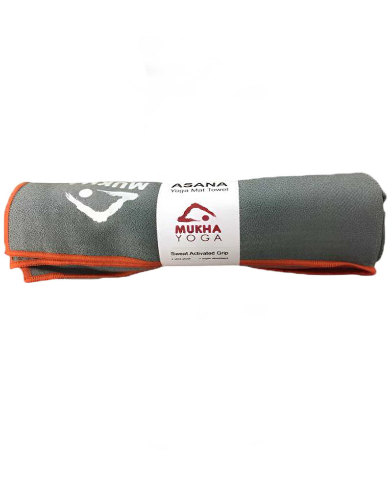 Gray and orange yoga towel with Mukha Yoga branding on a white background