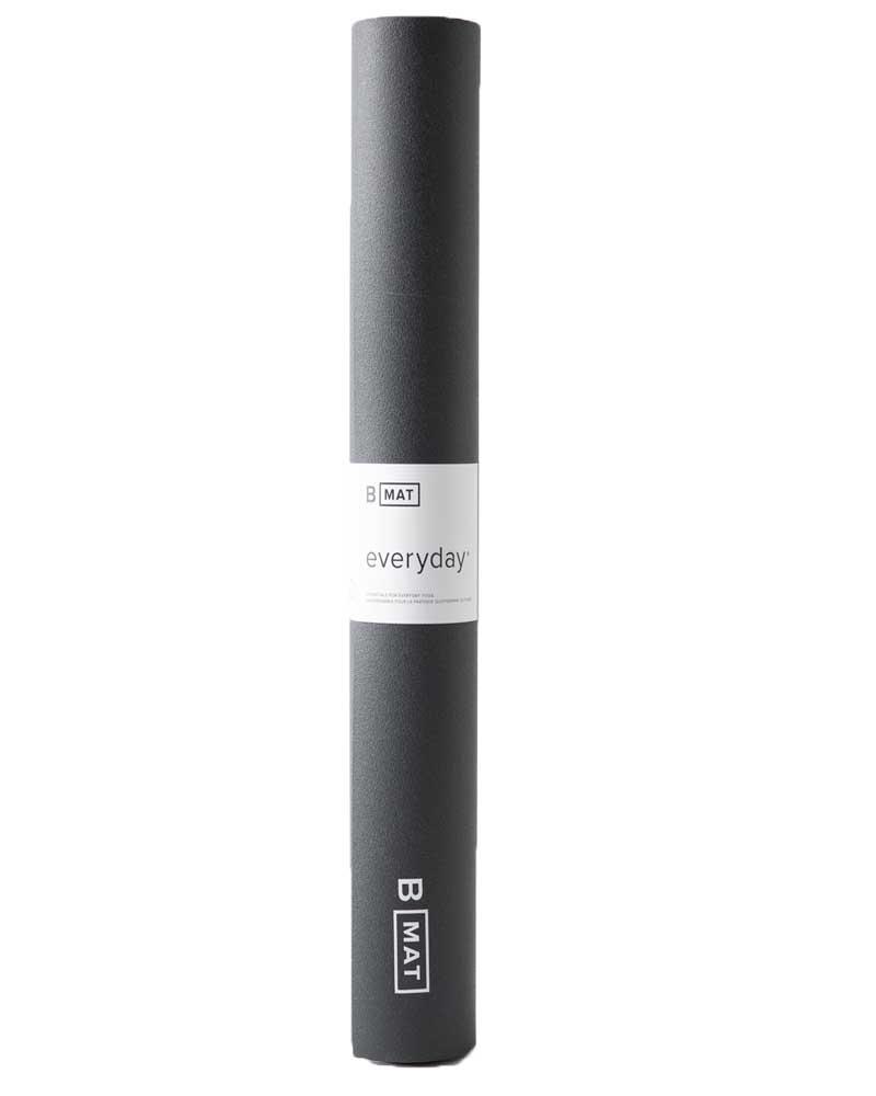 Black yoga mat with 'B MAT' branding on a white background